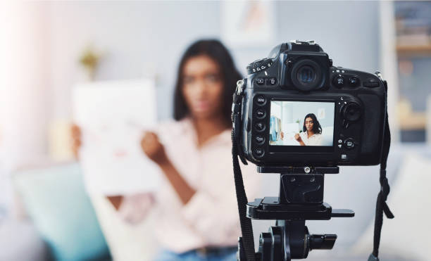 istock Influencer, content creation and makeup streamer on camera screen for podcast, demonstration or video. Filming, social networking and woman at home for online audience, presentation or digital review 2165357727