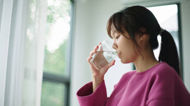 istock Teenager drinking water. 2165360359