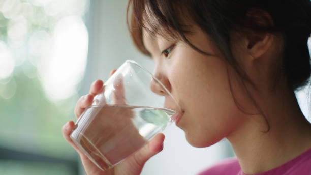 istock Teenager drinking water. 2165360371