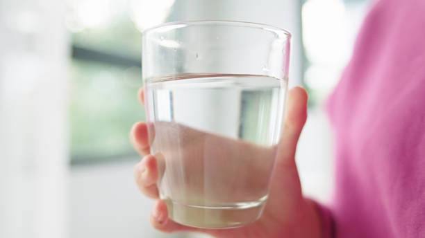 istock Teenager drinking water. 2165360372