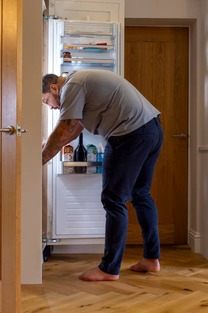 istock Looking for Something Tasty in the Fridge 2165363697