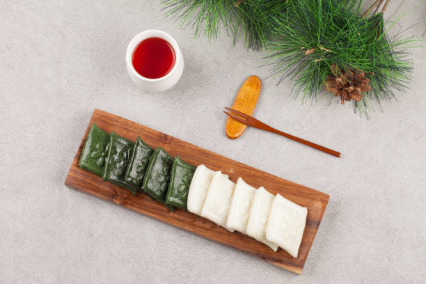 istock Rice cake made by pressing with rice cake meat into a square or round shape. It can also be made with things like mugwort or dyed in various colors. 2165368614