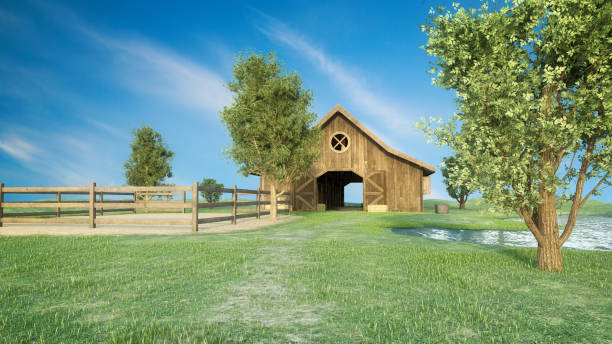 Old wooden plank barn with very worn red paint with hay loft in Montana in USA and North America.