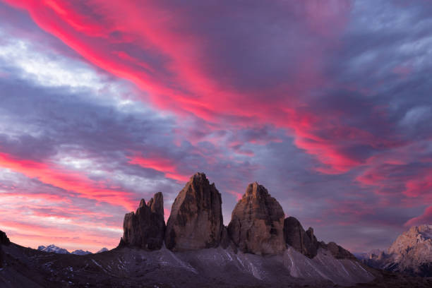 istock Majestic purple sunset on Three Peaks of Lavaredo mountains group 2165373621