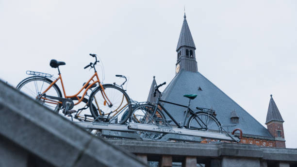Young woman cycling through the city center