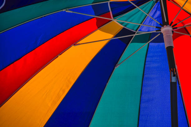 A colorful beach umbrella on a quiet beach