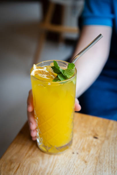 istock A woman is holding iced lemonade. 2165376074