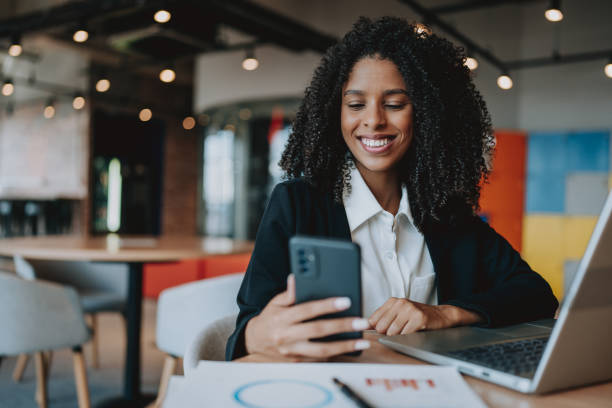 Young businesswoman using smartphone