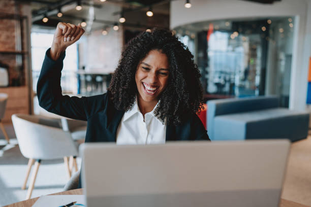 istock Young business woman cheering happily 2165381200