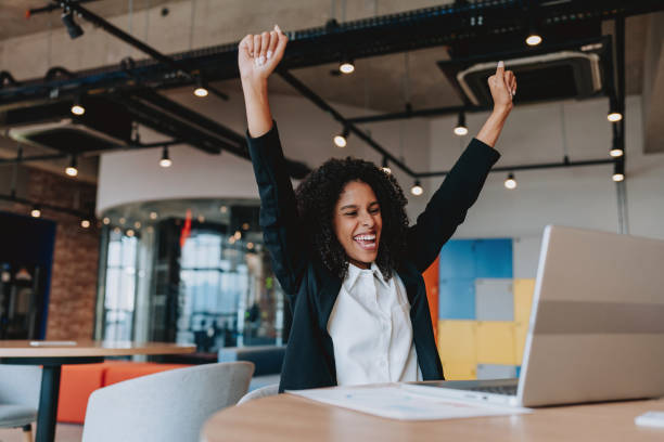 istock Young business woman cheering happily 2165381222