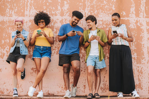 istock Group of friends using smartphone 2165382904
