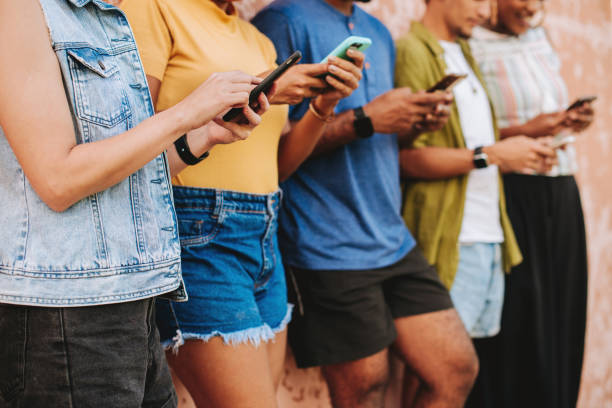 istock Group of friends using smartphone 2165382937