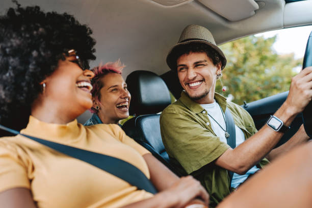 istock Happy friends traveling by car 2165382947