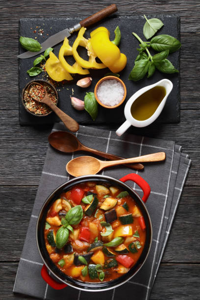 istock hearty italian vegetable stew in red pot, top view 2165383518