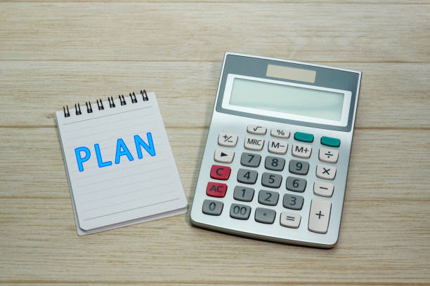istock The word PLAN written on a notepad and a calculator on a desk 2165383571