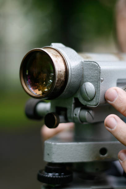istock a theodolite being adjusted by a surveyor's hands 2165390395