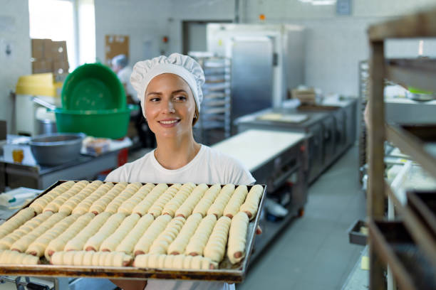 istock Baker admiring her pastries in a commercial bakery. 2165392678