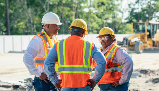 istock Three multiracial construction workers meet at job site 2165396555