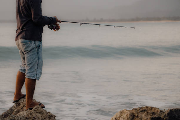 istock Fishing on the beach 2165398441