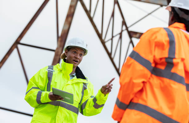 istock Multiracial women working, standing under gantry crane 2165398637