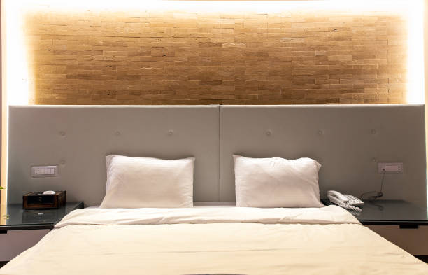 istock Interior of modern bedroom with large double comfortable bed 2165402020