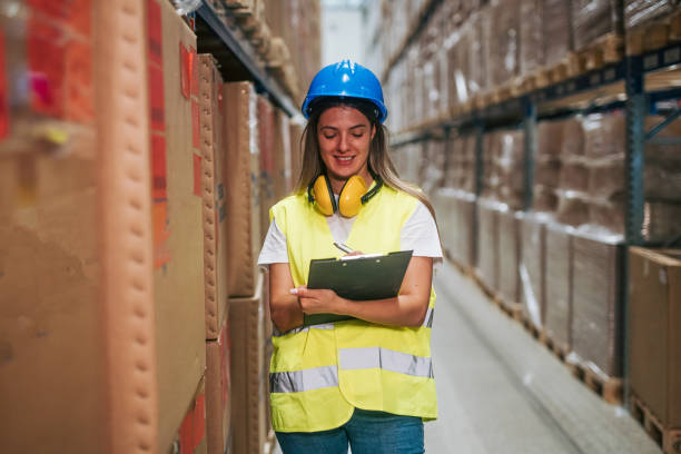 istock female Warehouse Worker with Clipboard 2165406689