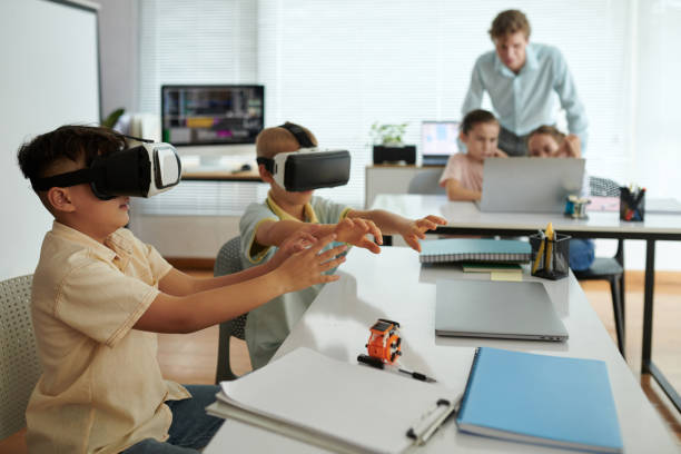 istock Children Experiencing Virtual Reality in Modern Classroom 2165411015