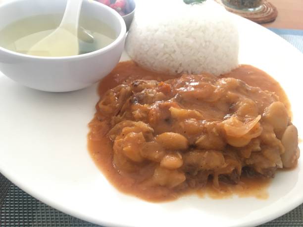 istock White Rice with Bean and Meat Stew in Tomato Sauce, Served with Broth 2165411263