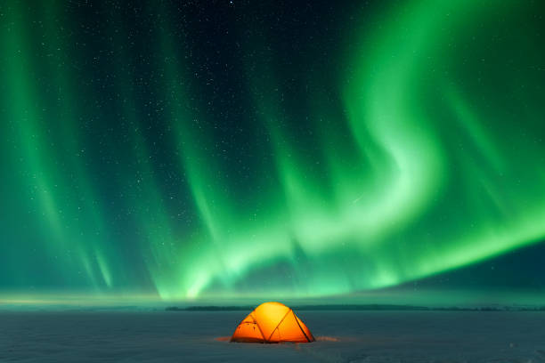 istock Orange tent and Northern lights 2165412758