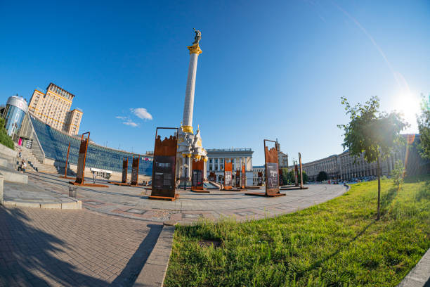 Evening view of the Independence Square background with monuments, Stella, Institutskaya Street, an exhibition of photographs ATO, Stalin and modern architecture KIEV, UKRAINE 08-04-2024.