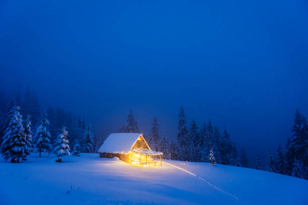 istock A winter landscape featuring an isolated wooden cabin 2165413352