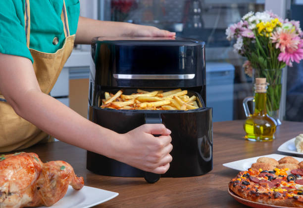 istock Preparing fried potatoes in the air fryer 2165414426
