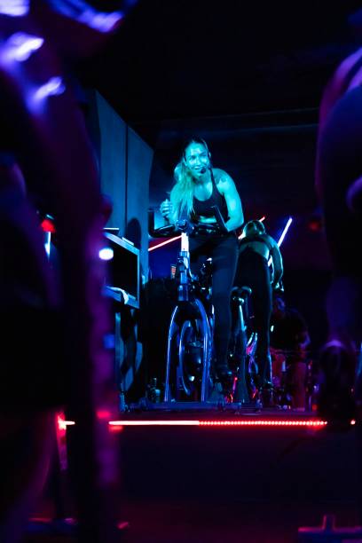 istock Indoor cycling coach giving instructions 2165415531