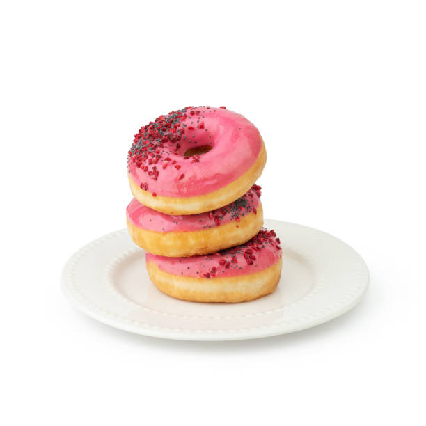 istock Donuts with pink cream in a white plate on a white background 2165415663