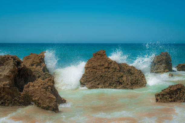 istock Sea Waves Hitting Rocky Coastline 2165418060