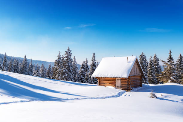 istock Fantastic landscape with snowy house 2165418229