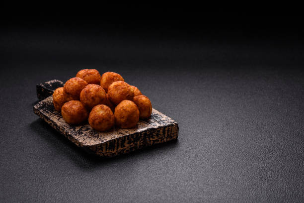istock Delicious crispy balls breaded with mozzarella cheese, salt and spices 2165418301