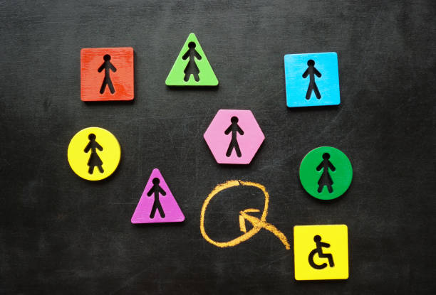 istock Different figures as a concept of inclusion. Hiring a person with a disability. 2165418430