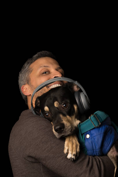 Happy man with dog and light fabric fun scarf friends pet. High quality photo