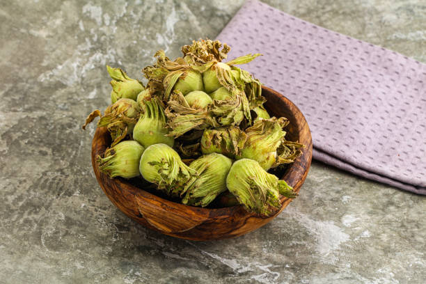 istock Fresh green ripe hazelnut heap 2165422003