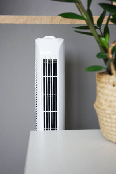 White tower fan in a modern interior