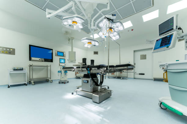 istock Empty operating room with operating table and surgical equipment 2165425357