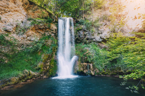 istock Veliki Buk waterfall in Serbia flows gracefully through a lush green forest, its cascading waters blending harmoniously with the natural beauty of the landscape. 2165429687
