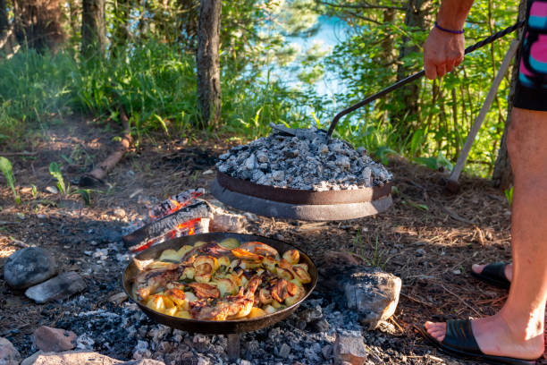 istock cooking in the open air on a campfire in the summer forest. 2165429764