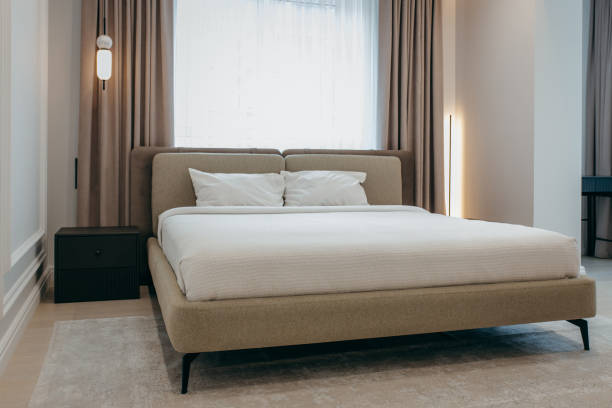 istock Bedroom with a bed, bedside table and lamps 2165432169