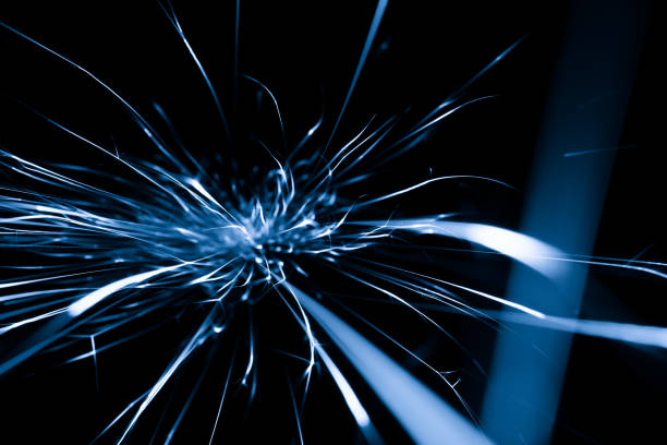 istock blue sparks from the grinder glowing in the dark 2165434077