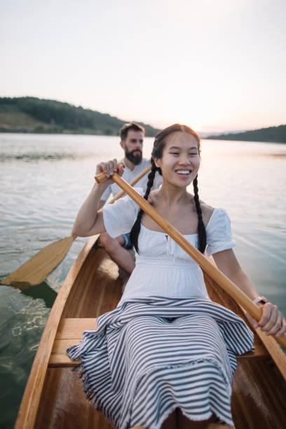 istock Smiling young woman enjoy  canoeing 2165435173