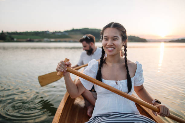 istock Smiling young woman enjoy  canoeing 2165435174