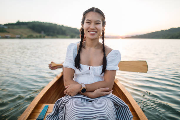 Young Asian woman enjoy time on the boat.