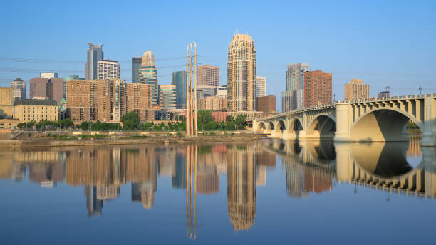 Minneapolis, Minnesota, USA - JULY 24, 2024: Downtown Minneapolis and the 3rd Avenue bridge from across the Mississippi River at Water Power Park